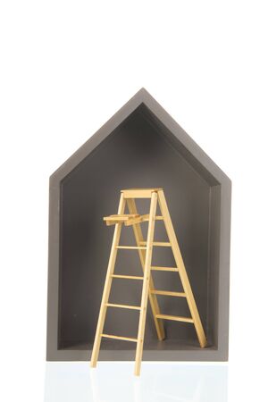 Simple grey wooden house with stairs isolated over white backgroundの写真素材