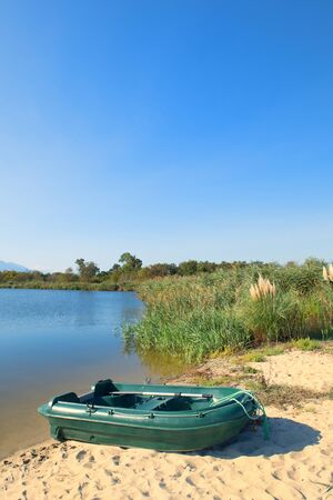 Corsica beach landscape east coast with Green boatの写真素材