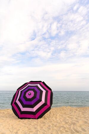 Vacation with shade with umbrella at the beachの写真素材