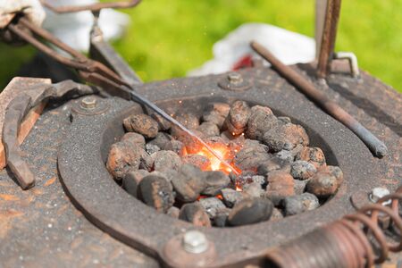 Blacksmith outdoor with coals and fireの写真素材
