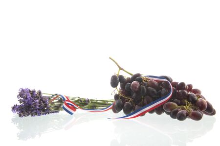 French lavender flowers and wine grapes isolated over whiteの写真素材