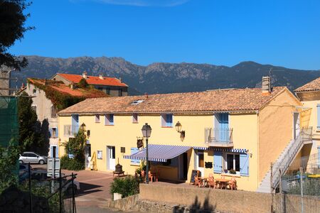 Village in landscape east coast Corsica France between mountainsの写真素材