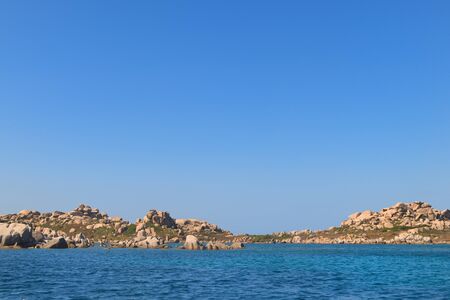 Rock formations and islands at south coast French Corsicaの写真素材