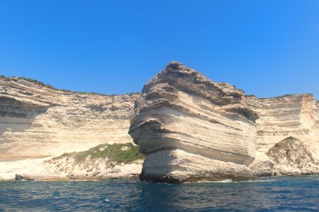 Rock formations and islands at south coast French Corsicaの写真素材