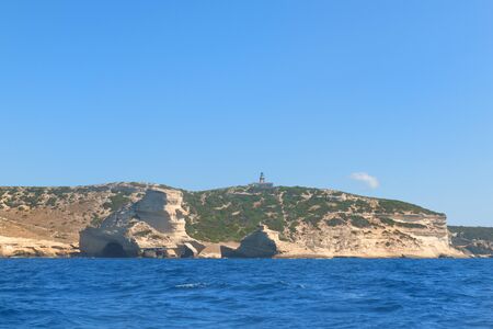Lighthouse at coast on island Corsica near Bonifacioの写真素材