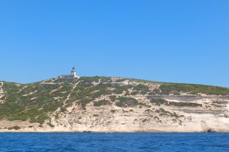 Lighthouse at coast on island Corsica near Bonifacioの写真素材