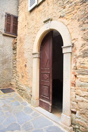 Open church door in French village Casincaの写真素材