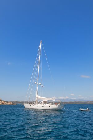Sailboat at coast French island Corsicaの写真素材