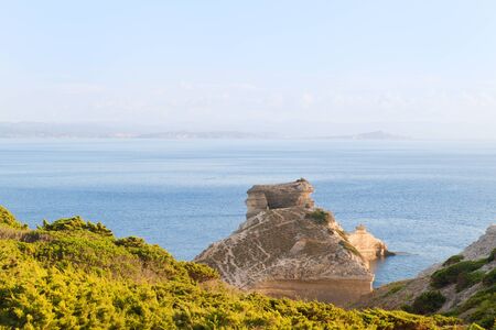 Rock formations and islands at south coast French Corsicaの写真素材