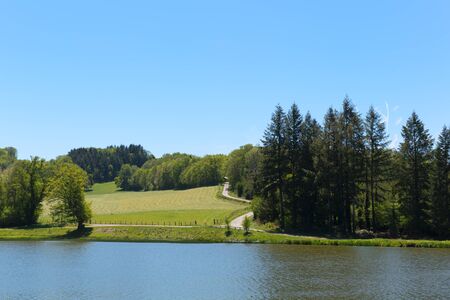 Landscape green hills and lake in French Nouvelle aquitaineの写真素材