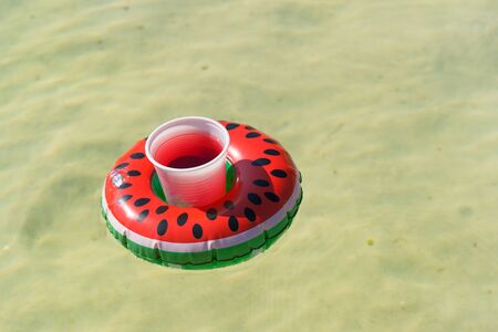 Inflatable water melon slice with cocktail drinkの写真素材