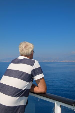 Senior man at cruise boatの写真素材