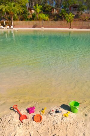 Plastic toys as bucket and shovel at the beachの写真素材