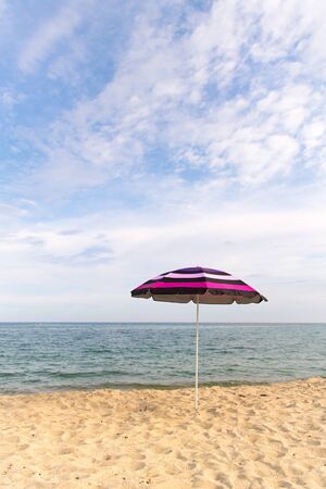 Vacation with shade with umbrella at the beachの写真素材