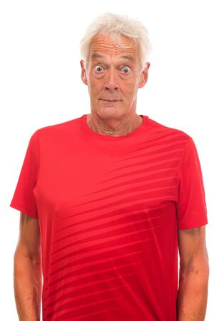 Portrait surprised senior sport man on whiteの写真素材