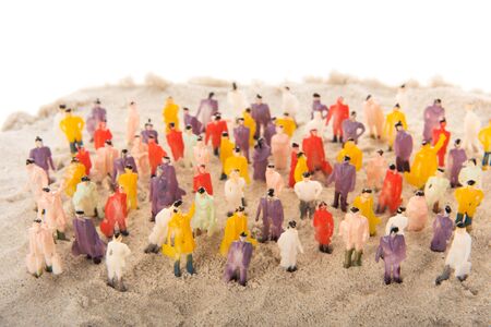 People crowd standing in sandの写真素材