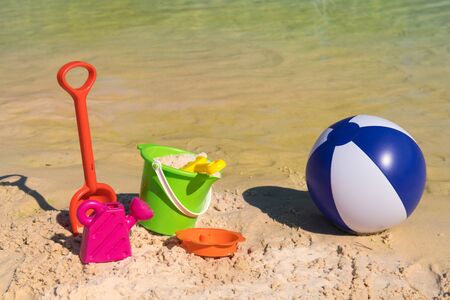 Plastic toys as bucket and shovel at the beachの写真素材