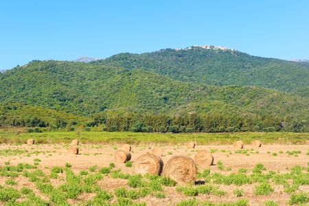 Landscape east coast Corsica France with mountains and villagesの写真素材