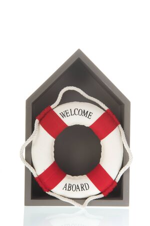 Red and white lifebuoy with welcome aboard isolated over white backgroundの写真素材