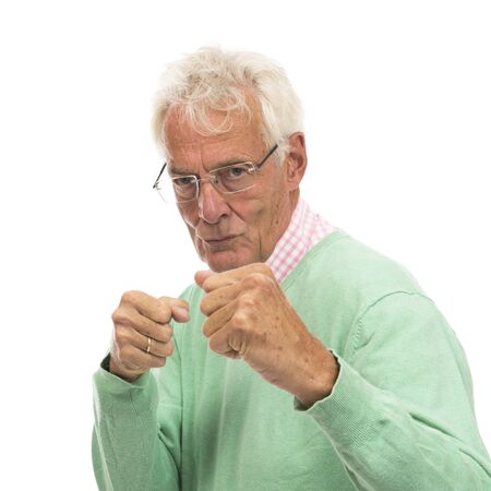 Angry senior man isolated over white backgroundの写真素材