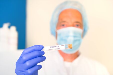 Doctor with covid-19 test setの写真素材