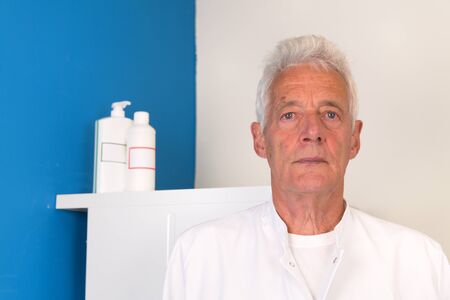Doctor with face mask and protective clothingの写真素材
