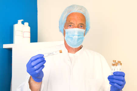 Doctor with covid-19 test setの写真素材