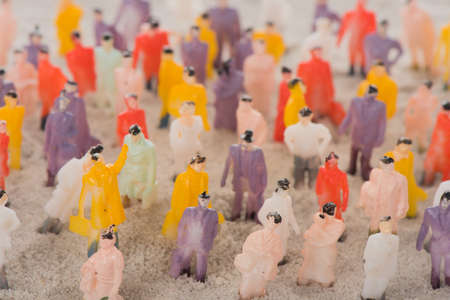 People crowd standing in sandの写真素材