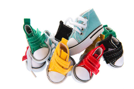 Colorful pile canvas sneakers isolated over white backgroundの写真素材