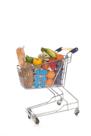 Shopping cart blue and yellow full with fresh groceriesの写真素材