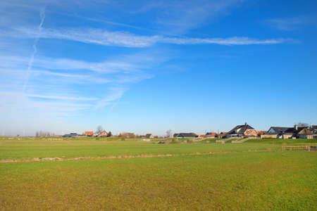Typical Dutch landscape in Polder at village Eemdijkの写真素材