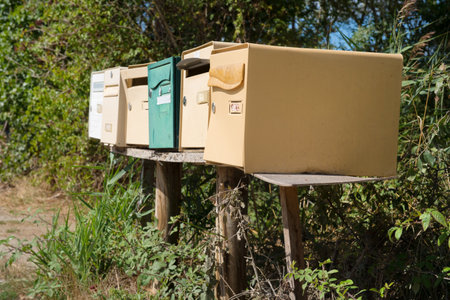 Many retro mail outdoor boxes in a rowの写真素材