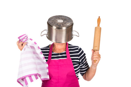 Funny woman with pin roller and pan isolated over white backgroundの写真素材