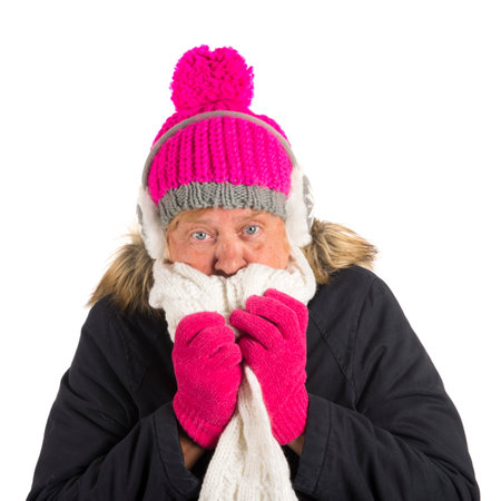 Healthy senior woman in winter time isolated over white backgroundの写真素材