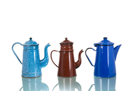 Vintage enamel coffee pots isolated over white backgroundの写真素材