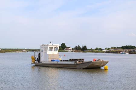 French wooden oyster boat at the river the Charenteの写真素材