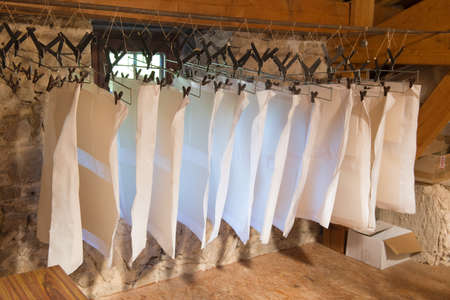 Hanging paper in mill interiorの写真素材
