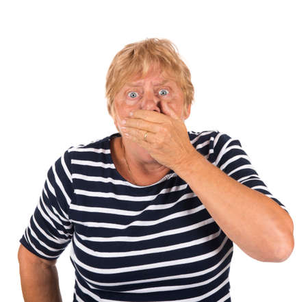 Scared blonde elder woman isolated over white backgroundの写真素材