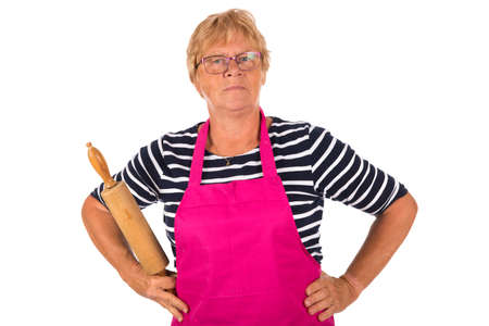 Very angry elder woman with pin roller isolated over white backgroundの写真素材