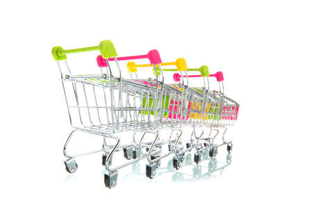 Row empty shopping carts isolated white backgroundの写真素材