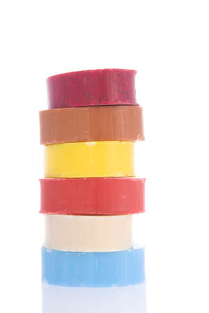 Stacked colorful soap bars isolated over white backgroundの写真素材