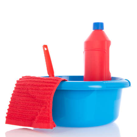 Plastic red bottle with blue cap in bucket with textile cloth isolated over white backgroundの写真素材