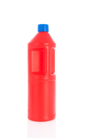 Plastic red bottle with blue cap isolated over white backgroundの写真素材