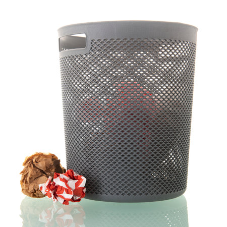 Gray paper bin with trash isolated over white backgroundの写真素材
