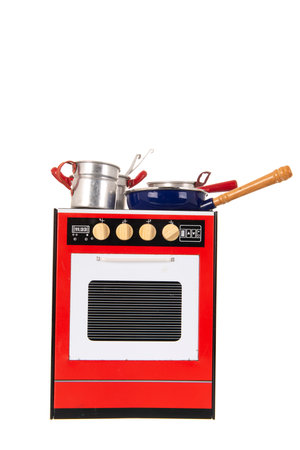 Miniature vintage toy four with utensil isolated over white backgroundの写真素材