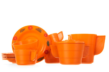 Vintage orange crockery isolated over white backgroundの写真素材