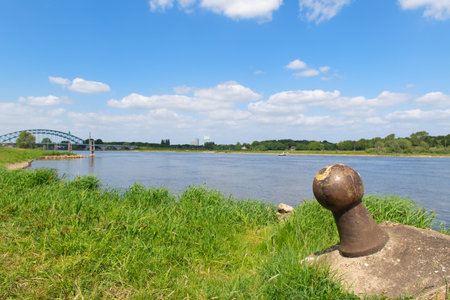 Landscape river the IJssel with green bridge to Zwolle in Hollandの写真素材