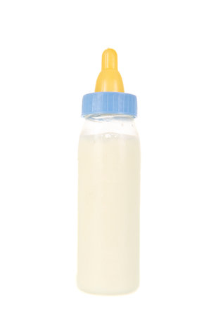 Baby bottle milk with dummy isolated over white backgroundの写真素材