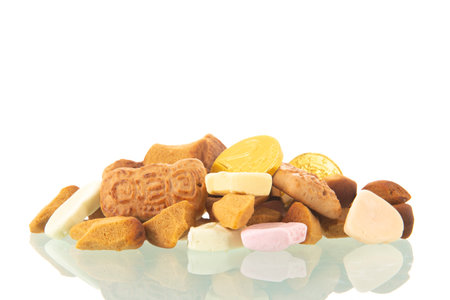Dutch Sinterklaas candy with ginger nuts and tough chewy isolated over white backgroundの写真素材