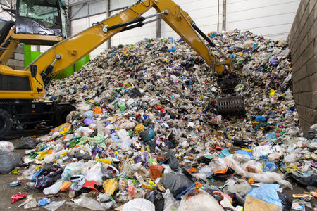 Collected plastic recycle material organized by crane